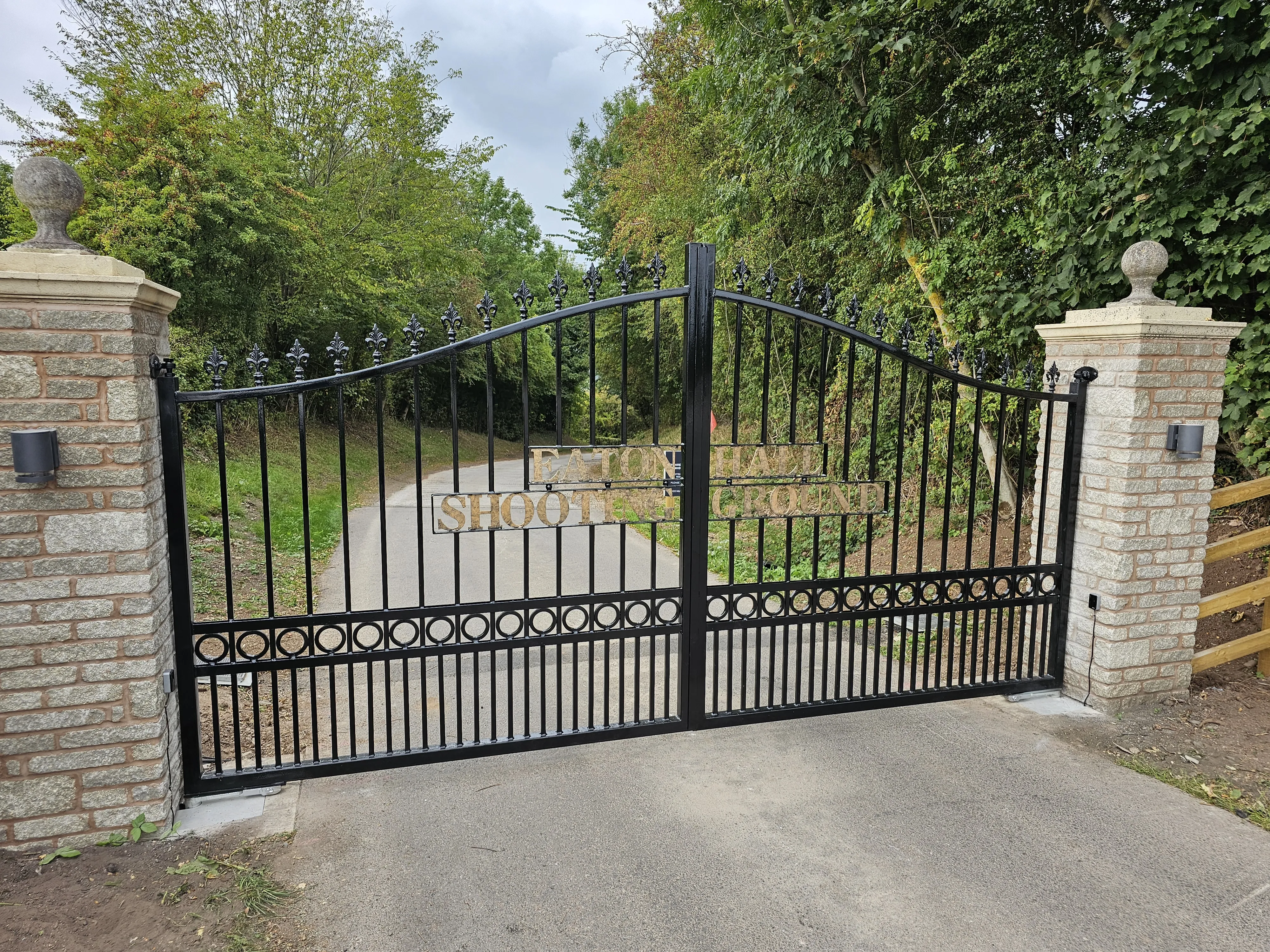 Swing gate with wrought iron decorative style