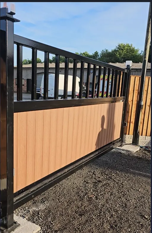 Sliding gate with bars and composite infill